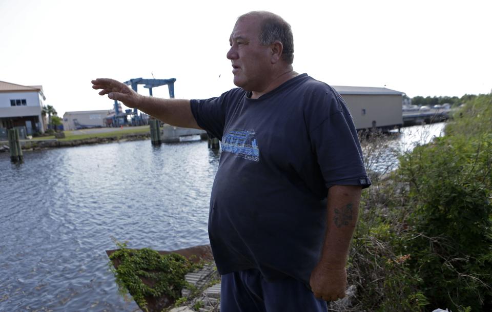 In this Oct. 9, 2013 file photo, Calvin Parker, Jr., stands in the area where he and fellow Mississippian Charles Hickson were allegedly abducted by aliens on Oct. 11, 1973, on the banks of the Pascagoula River in Pascagoula Miss. Parker died Aug. 24, 2023.