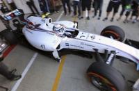 File photo of Williams Formula One test driver Susie Wolff of Britain as she leaves the pit during the first practice session for the British Grand Prix at the Silverstone Race circuit, central England, July 4, 2014. REUTERS/Francois Lenoir