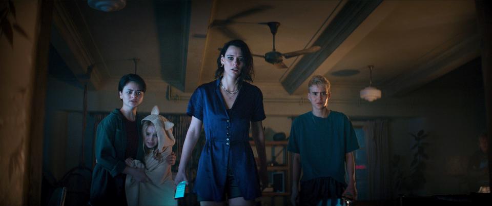 Beth (Lily Sullivan, center) protects her sister's kids – Bridget (Gabrielle Echols), Kassie (Nell Fisher) and Danny (Morgan Davies) – when a demonic presence enters their apartment in "Evil Dead Rise."