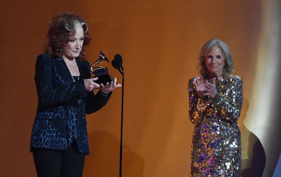 Bonnie Raitt accepts the award for song of the year from first lady Jill Biden, a Grammys presenter, in Los Angeles on Feb. 5, 2023. Raitt won for "Just Like That," which she said was inspired "by the incredible story of the love and the grace and the generosity of someone (who) donates their beloved's organs to help another person live."