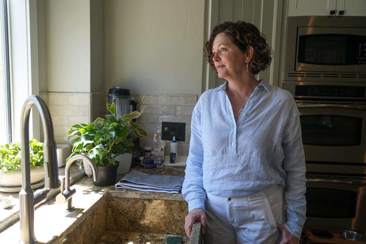 Jill Zinsmeyer, looking out of the window of her Lakeway home, had severe reactions to insect bites, heat and extreme temperature changes after moving to Texas. Doctors diagnosed her with indolent systemic mastocytosis.