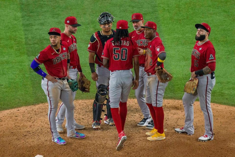 Diamondbacks relief pitcher Miguel Castro comes to the mound to face Rangers right fielder Adolis Garcia in the 11th inning.