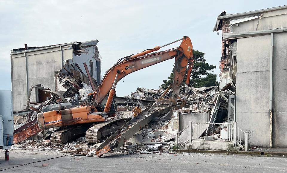 A crew from Britt Demolition and Recycling in Hanceville continues demolition work Wednesday on Gadsden's Convention Hall. The city's former top event venue closed in 2018 and is being torn down to make room for riverfront development.