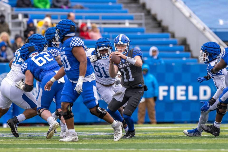 Kentucky backup quarterback Beau Allen (11) looks to pass the ball during the spring game at Kroger Field on Saturday.