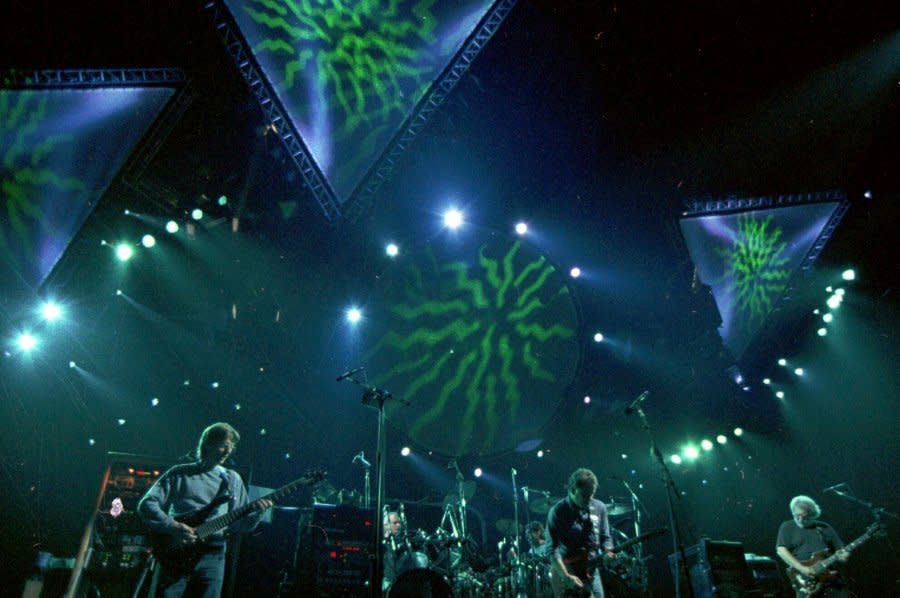 The Grateful Dead performs in Oakland, Calif., in 1993. The band has broken the record for the most Top 40 albums to chart on the Billboard 200. The Grateful Dead pulled out ahead of Elvis Presley and Frank Sinatra with 59 total Top 40 entries on the chart Monday following the No. 25 debut of their archival release “Dave’s Picks, Volume 49: Frost Amphitheatre, Stanford U., Palo Alto, CA (4/27/85 & 4/28/85).” (AP Photo/Eric Risberg, File)