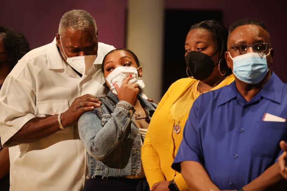Family members and an employee from the Tops supermarket attend services at True Bethel Baptist Church in Buffalo (Getty Images)