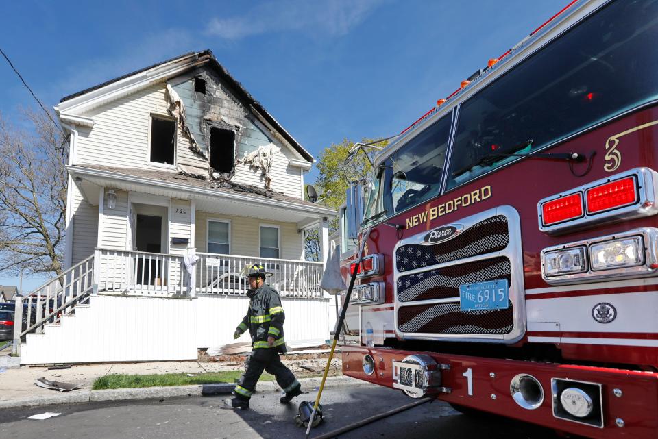 New Bedford fire respond to a fire on the second floor of a single family residence at 260 Chestnut Street Thursday. Four people were removed from the building and taken to St. Luke's Hospital. Fire officials confirm one of the residents has died.
