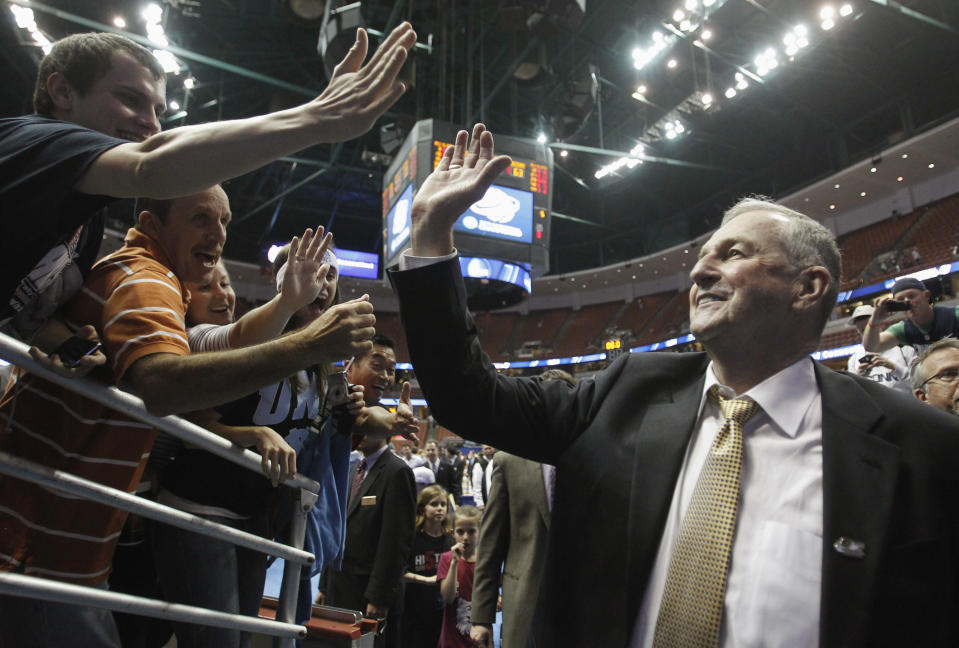 Connecticut Huskies head coach Jim Calhoun greets fans after his team defeated the Arizona Wildcats during their NCAA West Regional college basketball game in Anaheim, California March 26, 2011. REUTERS/Alex Gallardo (UNITED STATES - Tags: SPORT BASKETBALL)