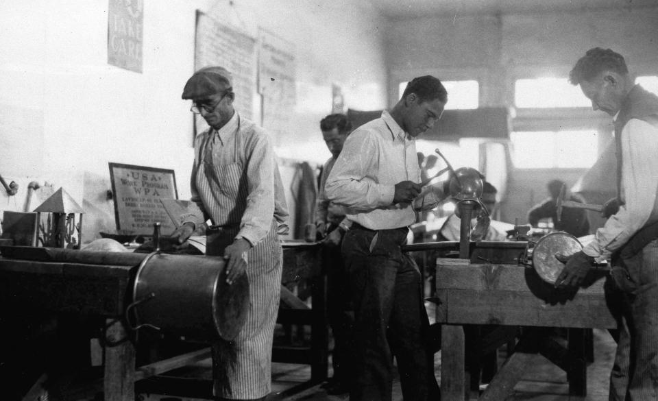 FILE - In this March 26, 1937, file photo, Works Progress Administration (WPA) workers make copper utensils for Pima County Hospital in Texas. The New Deal was a try-anything moment during the Great Depression that remade the role of the federal government in American life. (AP Photo, File)