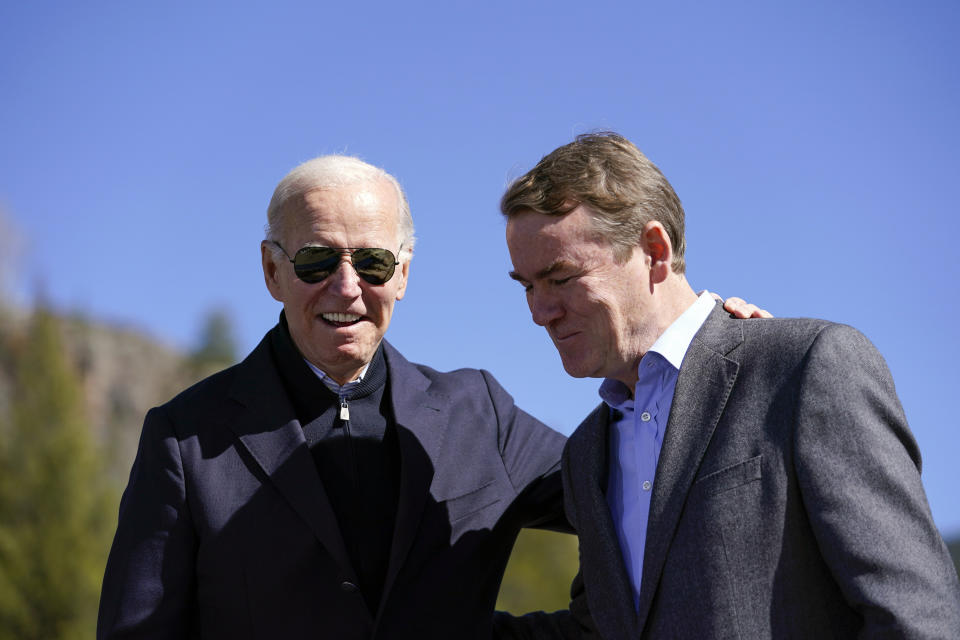 FILE - President Joe Biden stands with Sen. Michael Bennet, D-Colo., at Camp Hale near Leadville, Colo., Wednesday, Oct. 12, 2022. Biden designated the first national monument of his administration at Camp Hale, a World War II-era training site, as he called for protecting "treasured lands" that tell the story of America. (AP Photo/Carolyn Kaster, File)