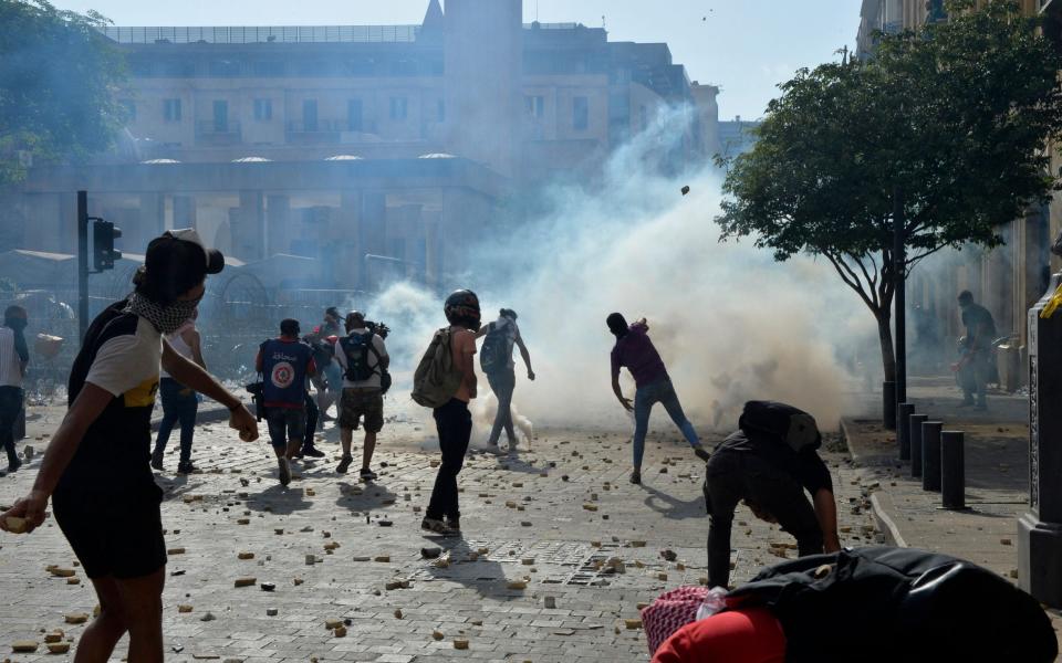 Anti-government protesters clash with Lebanese riot police during a protest outside of the Lebanese Parliament in Beirut  - WAEL HAMZEH/EPA-EFE/Shutterstock/Shutterstock