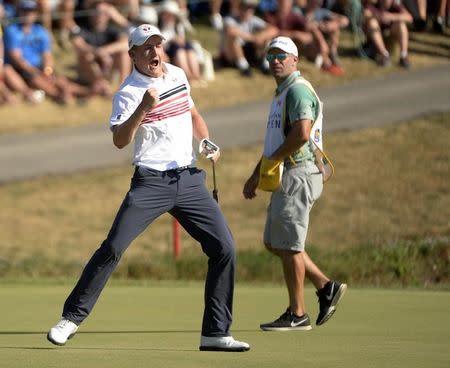 Jul 23, 2016; Oakville, Ontario, CAN; Jared du Toit (CAN) reacts after sinking his putt on the eighteenth hole during the third round of the RBC Canadian Open golf tournament at Glen Abbey Golf Club. Mandatory Credit: Eric Bolte-USA TODAY Sports