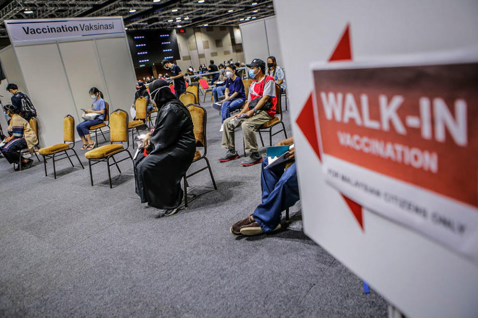 Walk-in recipients wait to get their Covid-19 vaccine injection at the Kuala Lumpur Convention Centre vaccination centre, August 2, 2021. ― Picture by Hari Anggara