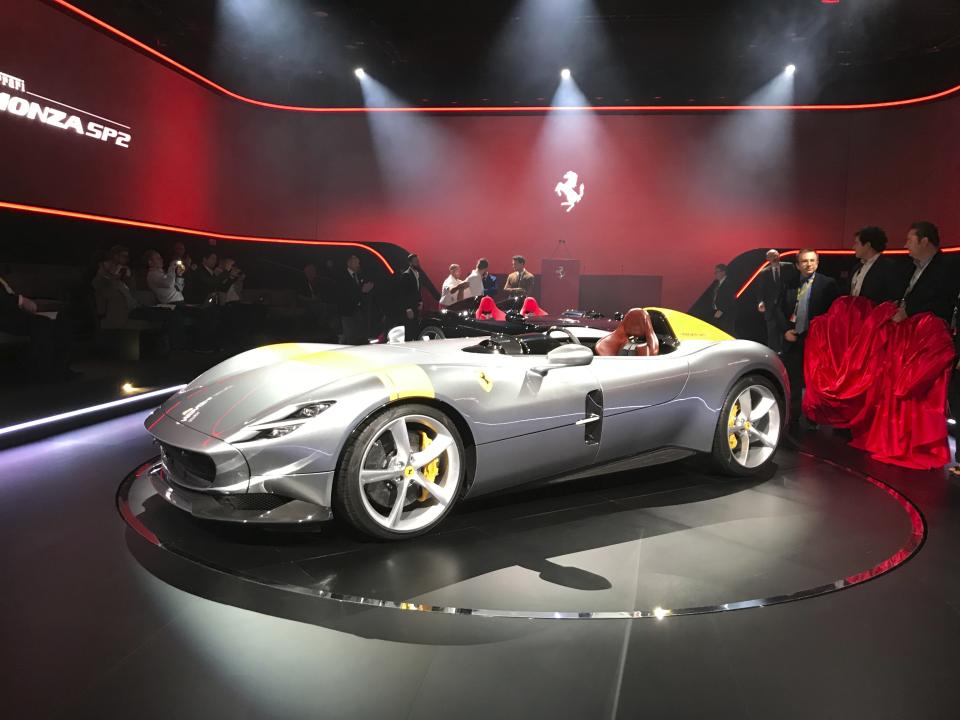 The Ferrari Monza SP1 is displayed in Maranello, Italy, Tuesday, Sept. 18, 2018. Sportscar maker Ferrari has unveiled two updated versions of its classic open-top "barchetta" racing model as it briefs investors on a new five-year business plan. Nicolo Boari, the head of product marketing, said Tuesday that the Ferrari Monza SP1 and SP2 are "the most powerful ever in Ferrari history," with an 810 horsepower engine able to reach 100 kilometers per hour (62 mph) in 2.9 seconds. (AP Photo/Collen Barry)