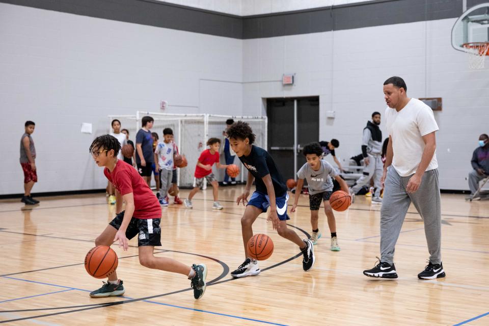 Top City Crushers coach Jameel Anderson has his players work on drills during practice at Hillcrest Community Center on Sunday afternoon.