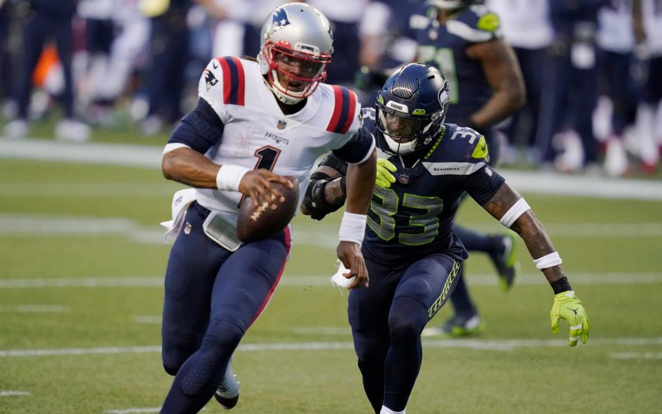 Seattle Seahawks strong safety Jamal Adams (33) closes in on a sack of New England Patriots quarterback Cam Newton (1) during the second half of an NFL football game, Sunday, Sept. 20, 2020, in Seattle. - AP