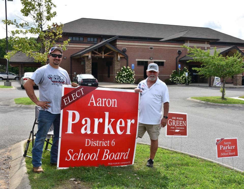 Aaron Parker and Johnnie Reed at the voting site at the Bibb-White Bluff Civic Center on Election Day, Aug. 4, 2022.