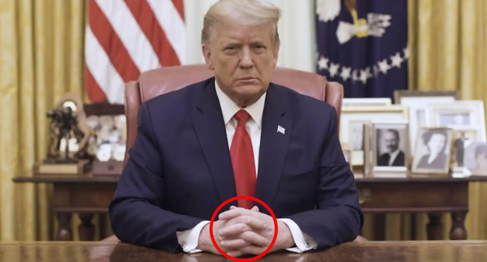 Donald Trump clenches his fists in a video of his speech. 