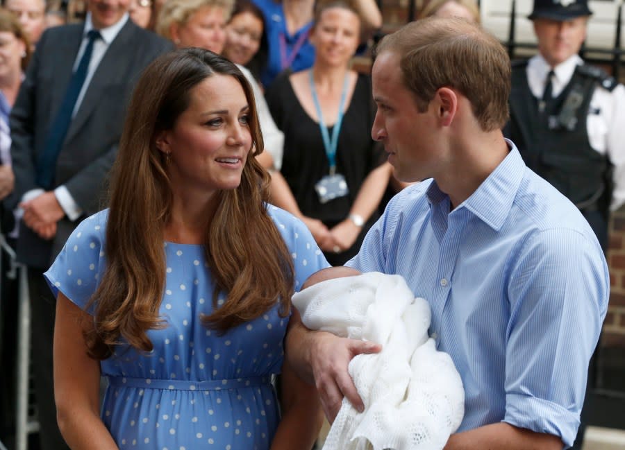 FILE – Britain’s Prince William and Kate, Duchess of Cambridge hold the Prince of Cambridge, Tuesday July 23, 2013, as they pose for photographers outside St. Mary’s Hospital exclusive Lindo Wing in London where the Duchess gave birth on Monday July 22. (AP Photo/Lefteris Pitarakis, File)