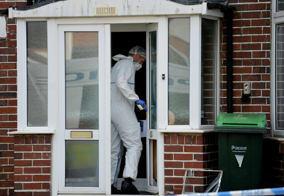 Police forensics at the scene in Moat Road in Oldbury, West Mids, where the bodies of a middle-aged couple were found in their home this morning.  February 25, 2020.  See SWNS story SWMDmurders.  A 25-year-old man was arrested on suspicion of double murder today (Tues) after the bodies of a middle-aged couple were found in their home.  Police officers forced their way into a house in Moat Road in Oldbury, West Mids., at 4am after receiving calls regarding the welfare of the couple.  Inside the property officers found the bodies of a woman, 54, and a 52-year-old man who were pronounced dead at the scene.  At 5.30am detectives arrested a 25-year-old man at an address in nearby Smethwick.  Police are not confirming if the man was the victims parents but say they are treating the murders as a domestic-related incident.  A West Midlands Police spokesperson said: Weve arrested a man on suspicion of murder after the bodies of two people were found in Oldbury today.   