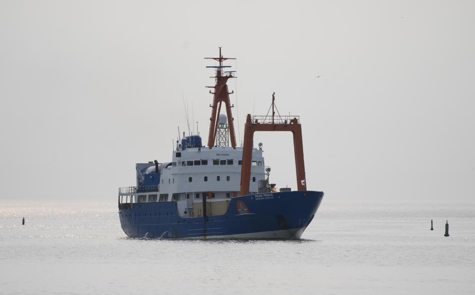 The Polar Prince arrives, Saturday, June 24, 2023 at the port in St. John's, Newfoundland. Authorities from the U.S. and Canada began the process of investigating the cause of the fatal Titan submersible implosion even as they grappled with questions of who was responsible for determining how the tragedy unfolded. (Adrian Wyld /The Canadian Press via AP)