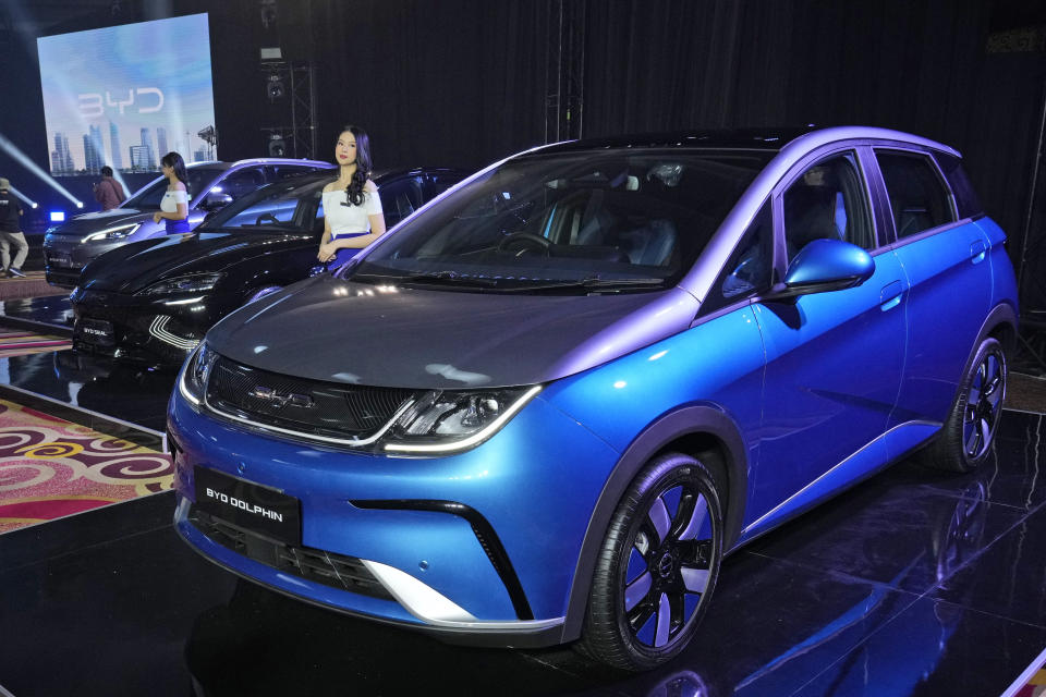 China's top electric car maker BYD launched the three electric vehicles into the Indonesian market Thursday, bolstering its presence in Southeast Asia's largest economy. (AP Photo/Achmad Ibrahim)