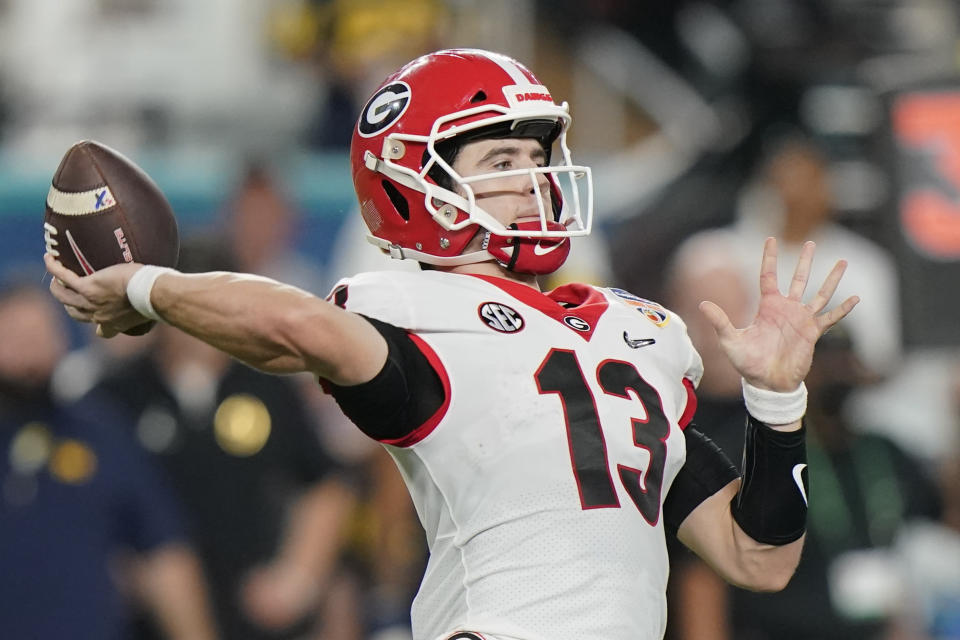 Georgia quarterback Stetson Bennett passes against Michigan during the first half of the Orange Bowl NCAA College Football Playoff semifinal game, Friday, Dec. 31, 2021, in Miami Gardens, Fla. (AP Photo/Lynne Sladky)