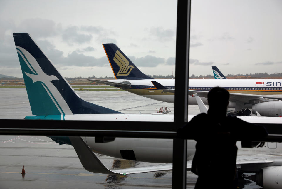 A SilkAir plane sits beside a Singapore Airlines plane at Changi Airport. Photo: REUTERS/Edgar Su