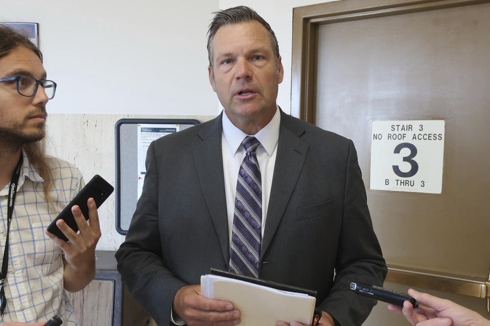 Kansas Attorney General Kris Kobach speaks to reporters following a hearing in his state-court lawsuit against the state allowing transgender people to change the sex listing on their driver's licenses, Thursday, July 20, 2023, in Topeka, Kansas. Kobach is trying to keep five transgender Kansas residents from intervening in his lawsuit against the state agency that issues driver's licenses. (AP Photo/John Hanna)