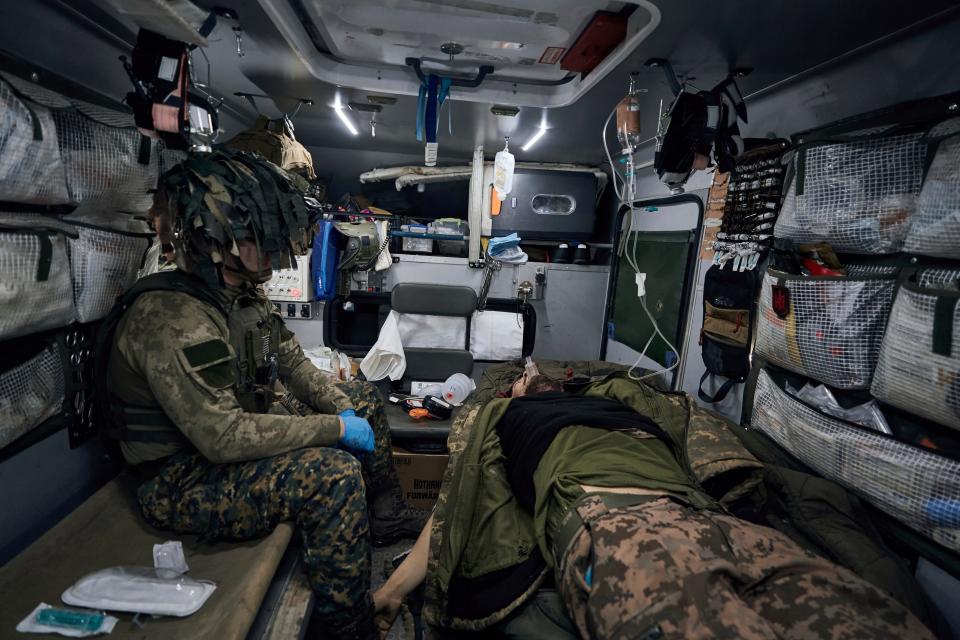 A military medic inside a vehicle evacuates a soldier wounded in a battle with the Russian invaders near Kremenna in the Luhansk region, Ukraine (Copyright 2023 The Associated Press. All rights reserved.)