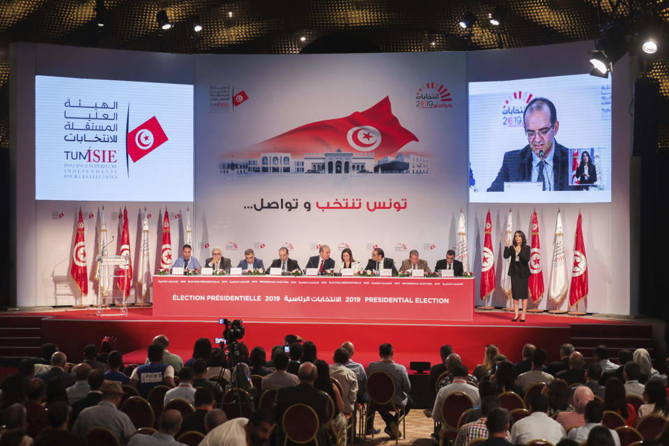 The Independent High Electoral Commission announces the results of the presidential election in Tunisia, Monday, Oct. 14, 2019. Tunisia’s electoral body said official preliminary results show that conservative, Islamist-backed law professor Kais Saied has largely won the presidential election. (AP Photo/Mosa'ab Elshamy)