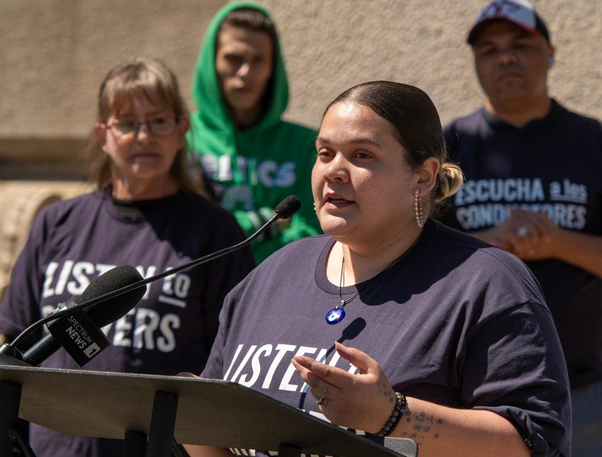 Rideshare driver Dignamar Figueroa of Worcester speaks during a rally in support of driver independence at City Hall Tuesday.