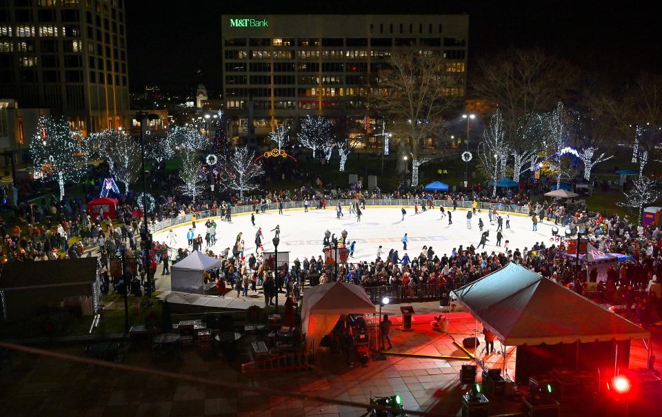 A large crowd turned out to ice skate, admire the lights and to hear "The Voice" competitors Cara Brindisi of Worcester and Kara McKee of Rhode Island sing onstage (under the large tent) during the annual Festival of Lights celebration.