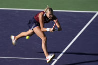 Anett Kontaveit, of Estonia, hits a backhand to Ons Jabeur, of Tunisia, at the BNP Paribas Open tennis tournament Thursday, Oct. 14, 2021, in Indian Wells, Calif. (AP Photo/Mark J. Terrill)