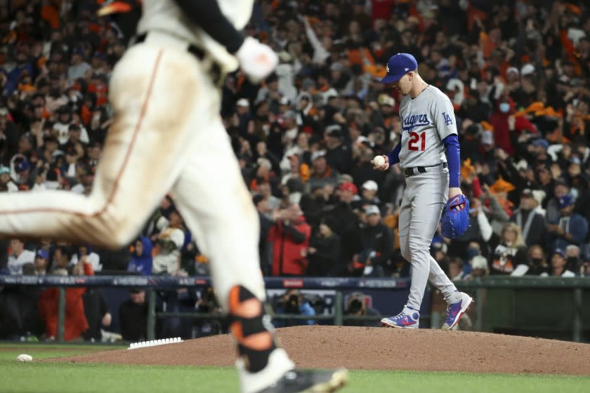 Dodgers starter Walker Buehler reacts after giving up a homer to the Giants' Kris Bryant in the seventh inning Oct. 8, 2021.