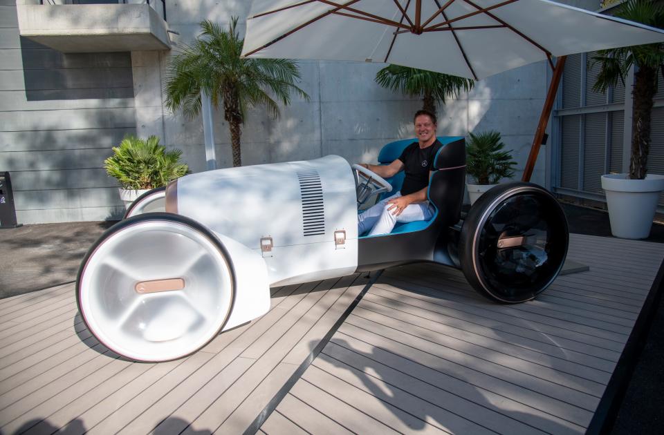 Gorden Wagener, Chief Design Officer of Daimler, poses in the Mercedes Vision Simplex, a throwback to a 1901 race car.