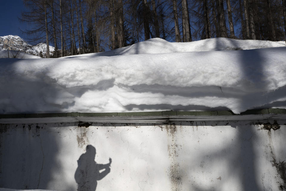 A view of the bobsled track in Cortina d'Ampezzo, Italy, Wednesday, Feb. 17, 2021. Bobsledding tradition in Cortina goes back nearly a century and locals are hoping that the Eugenio Monti track can be reopened for the 2026 Olympics in the Italian resort. (AP Photo/Gabriele Facciotti)