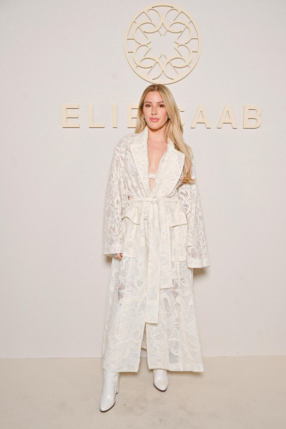 Ellie Goulding attends the Elie Saab Haute Couture Fall/Winter 2024-2025 show as part of Paris Fashion Week wearing white boots