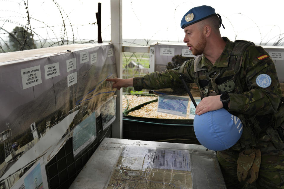 Capt. Hector Alonso Garcia of the Spanish UNIFIL battalion, the United Nations peacekeeping force in south Lebanon, shows on a map the blue line, a U.N.-drawn boundary between Lebanon and Israel, at an observation tower in Abbassiyeh, a Lebanese border village with Israel, on Wednesday, Jan. 10, 2024. The prospect of a full-scale war between Israel and Lebanon’s Hezbollah militia terrifies people on both sides of the border, but some see it as an inevitable fallout from Israel’s ongoing war against Hamas in Gaza. (AP Photo/Hussein Malla)