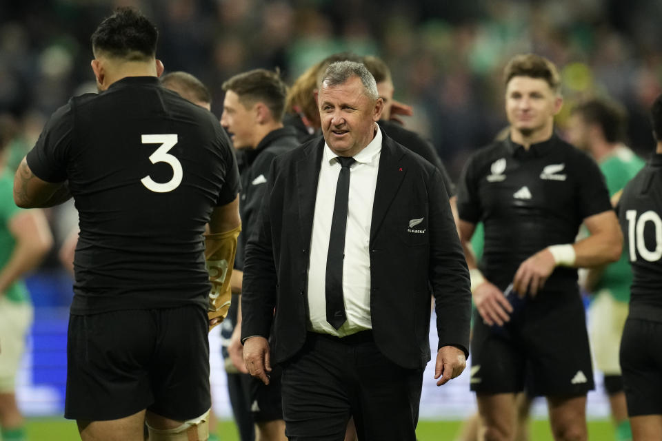 New Zealand's head coach Ian Foster congratulates his players after the end of the Rugby World Cup quarterfinal match between Ireland and New Zealand at the Stade de France in Saint-Denis, near Paris Saturday, Oct. 14, 2023. New Zealand won the game 28-24. (AP Photo/Christophe Ena)