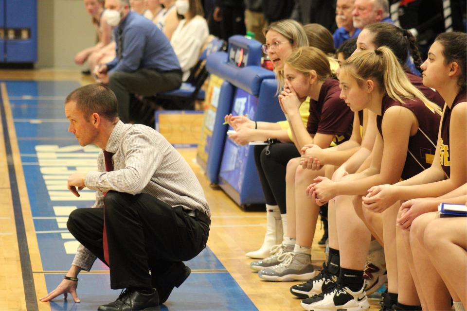 Case coach David Silva and his bench watch on in a Division IV playoff against Lunenburg last year.