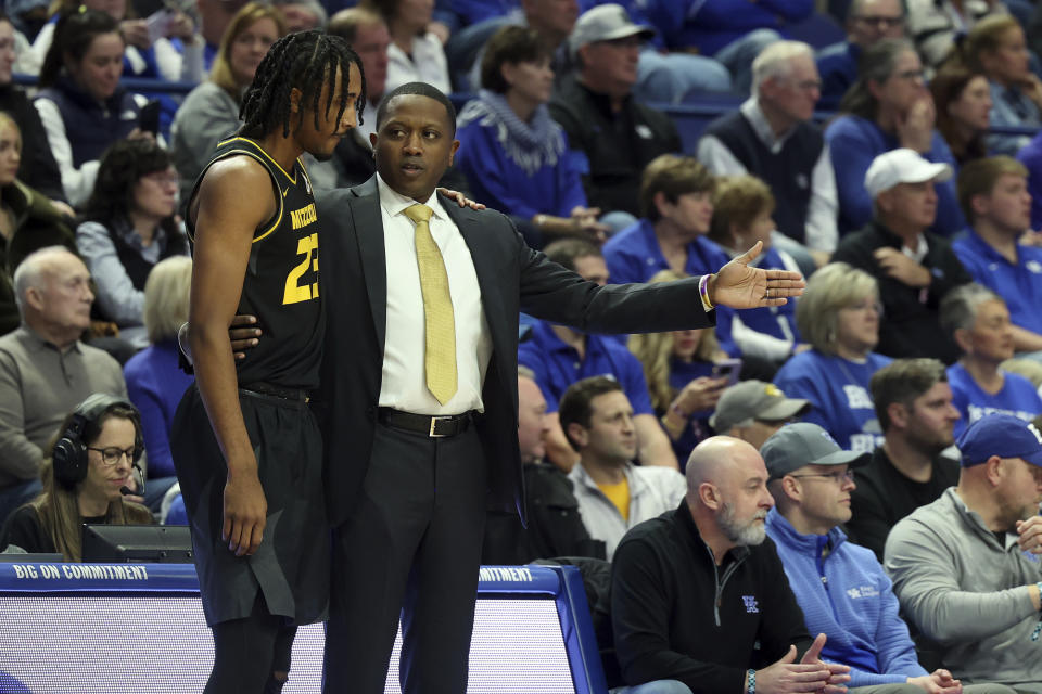 Missouri head coach Dennis Gates, right, instructs Aidan Shaw (23) during the first half of an NCAA college basketball game against Kentucky in Lexington, Ky., Tuesday, Jan. 9, 2024. (AP Photo/James Crisp)