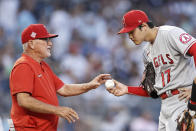 Los Angeles Angels manager Joe Maddon takes the ball from pitcher Shohei Ohtani during the first inning of the team's baseball game against the New York Yankees on Wednesday, June 30, 2021, in New York. (AP Photo/Adam Hunger)