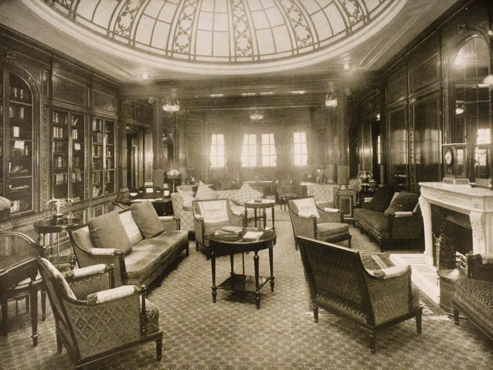 The library and writing room with books, armchairs, and sofas aboard the Mauretania circa 1930