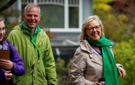 FILE PHOTO: Green Party leader Elizabeth May greets voters with Green Party Member David Merner during an election campaign visit in Victoria