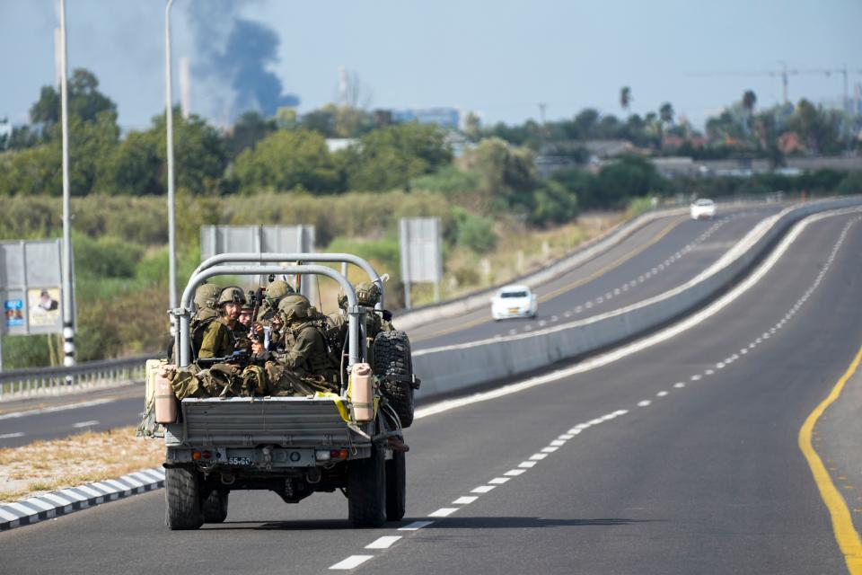 Israeli soldiers head south near Ashkelon, Israel, Israel, on Saturday, Oct. 7, 2023. Palestinian militants in the Gaza Strip infiltrated Saturday into southern Israel and fired thousands of rockets into the country while Israel began striking targets in Gaza in response.