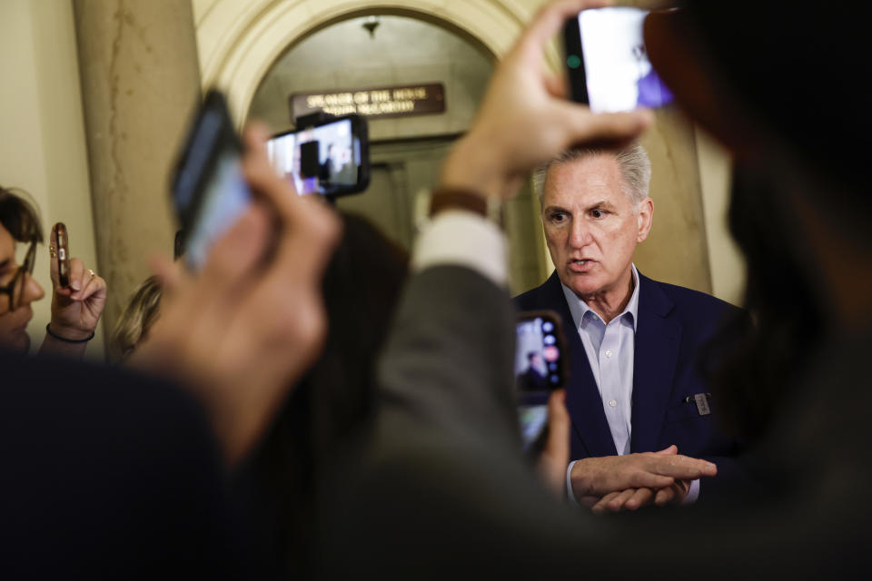 House Speaker Kevin McCarthy talks to reporters outside his office at the U.S. Capitol Building on Tuesday. 