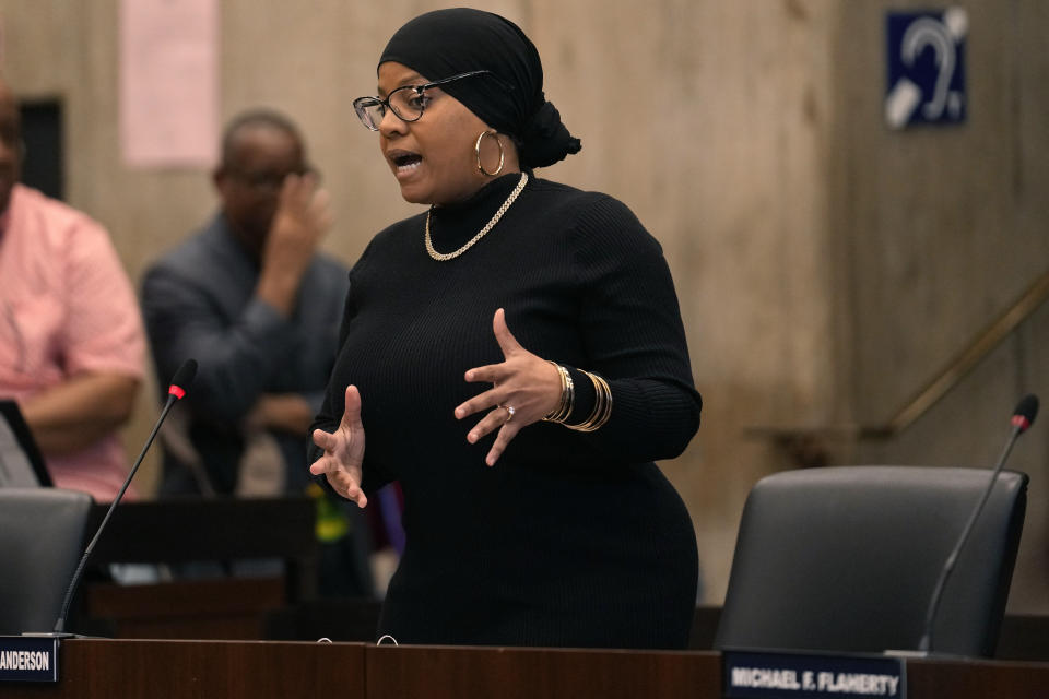 Boston City Councilor Tania Fernandes Anderson addresses Boston City Council members during a meeting at City Hall, in Boston, Wednesday, Oct. 25, 2023, as they debate the renaming of Faneuil Hall, a popular tourist site. Fernandes Anderson has filed a resolution decrying the building's namesake, Peter Faneuil, as a "white supremacist, a slave trader, and a slave owner who contributed nothing recognizable to the ideal of democracy." The council voted Wednesday in favor of holding a hearing on changing the name of Faneuil Hall. (AP Photo/Steven Senne)