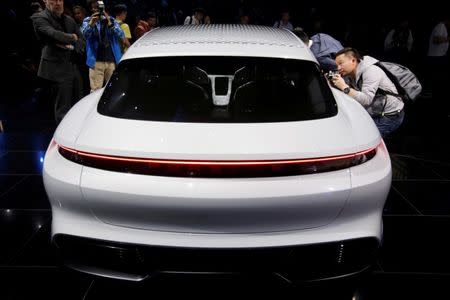 FILE PHOTO: A Porsche Mission E Cross Turismo is displayed at a Volkswagen Group media event ahead of the Beijing Auto Show in Beijing, China April 24, 2018. REUTERS/Jason Lee/File Photo