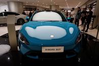 Xiaomi's first electric vehicle SU7 is displayed at a showroom of a newly opened Xiaomi store in Beijing